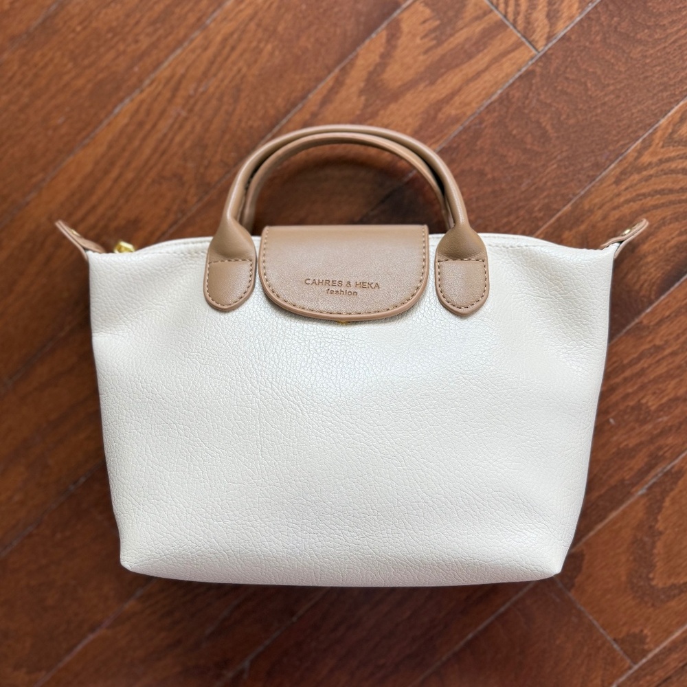 Cahres and Heka handbag